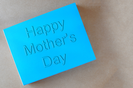 Happy mothers day words on blue book, holiday and event concept and mothers day ideaの写真素材
