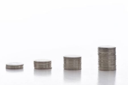 Stack of coins on white background, business success concept and growth idea