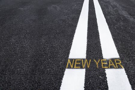 Road to the new year,  asphalt road with future word and marking lines, happy new year conceptの写真素材