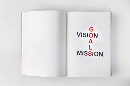 Words of goals, vision and mission on book, business concept and success ideaの写真素材