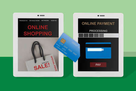 Online payment application with credit card and online shopping website on computer tablet screenの写真素材