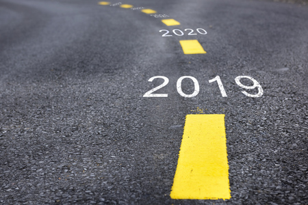 Number of 2019 to 2023 on asphalt road surface with marking lines, happy new year conceptの写真素材
