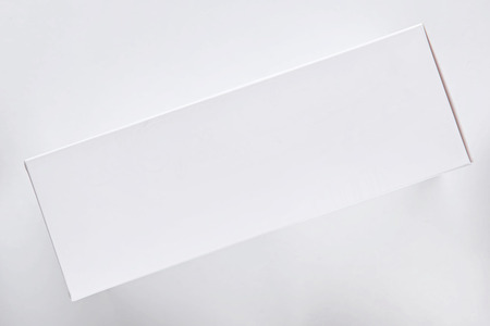 Top view of white gift box on white background, holiday and event concept. Copy space for textの写真素材