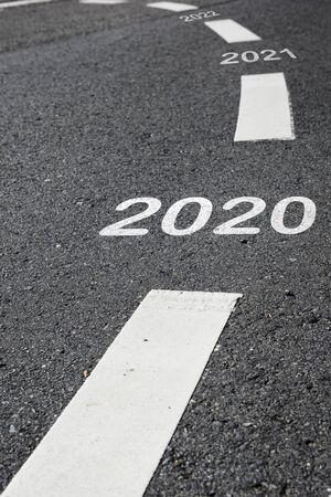 2020 to 2022 on black asphalt road and white marking lines, Happy new year and road to success...