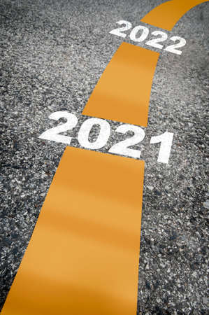 Happy new year 2021 to 2022 on road surface. Business trend concept and challenge idea