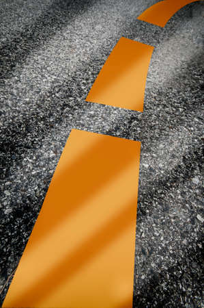 Closeup empty asphalt road with yellow marking line. Abstract background concept and transportation ideaの写真素材