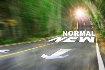 New normal word on motion blurred view of high speed road. Business challenge form COVID-19 concept and competition ideaの写真素材