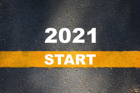 New year 2021 on road and start on yellow line. Business beginning development concept and success...