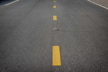 Closeup asphalt road with marking lines for separate laneの写真素材