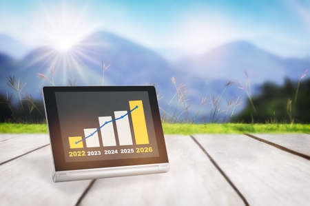 2022 to 2026 sustainable business strategy and financial growth graph stock trading on computer...