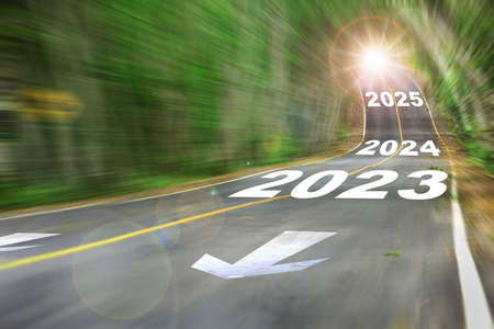 New year 2023, 2024 and 2025 on Motion blurred view of high speed road. Business challenge concept and competition ideaの写真素材