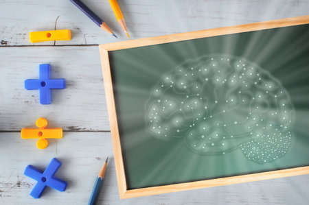 Brain drawing on chalkboard with mathematics symbol and colored pencil on wooden desk. Growth mindset concept and skill set development ideaの写真素材