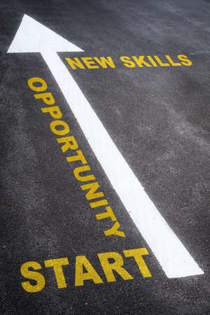 Start to fnd opportunity in a crisis with new skill written on the road. Business planning concept and beginning success ideaの写真素材