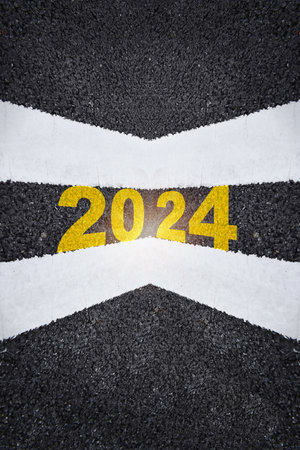 Top view new year 2024 written on asphalt road. Recovery concept and challenge success