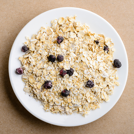 Tasty healthy and dietary breakfast: homemade oatmeal with blackcurrant. Top view, flat layの写真素材