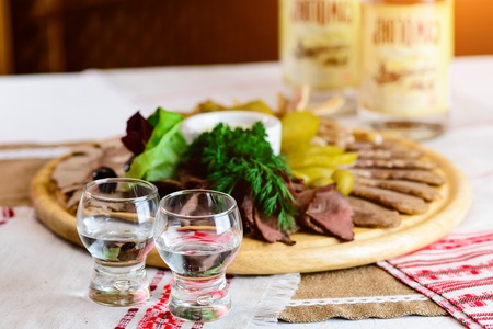 Tasty meat set: beef slices, bacon, smoked ears, pickles and sauの写真素材