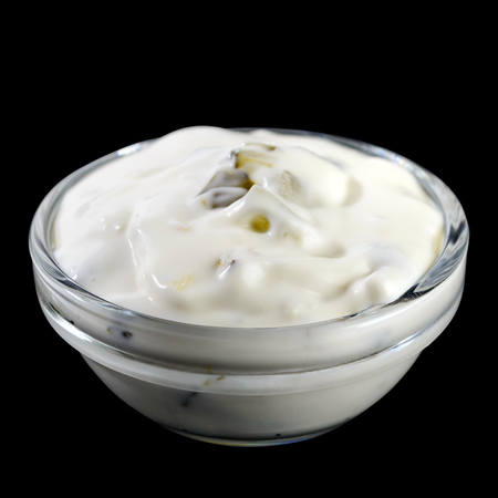 White garlic and herbs sauce in a small glass bowl isolated on bの写真素材