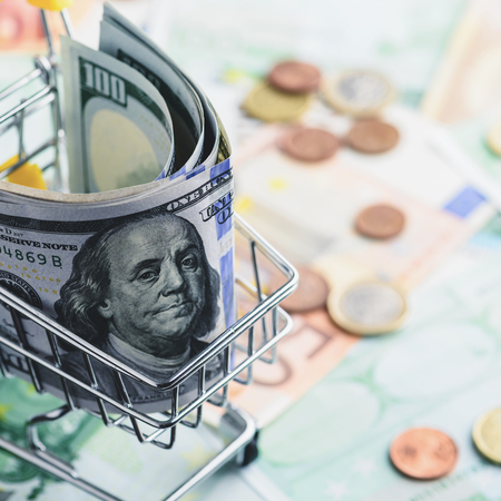 One hundred dollar bills in the shopping cart, toned image. Concの写真素材