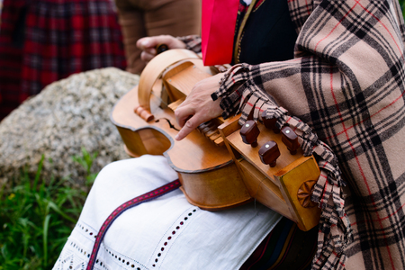 close-up of female hands playing luteの写真素材