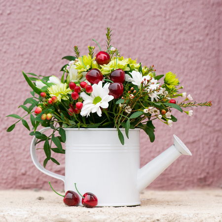 watering can with flowersの写真素材