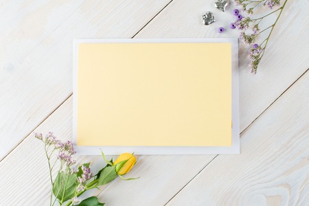 blank card on wooden background with flowers, heart, ribbon, Flaの写真素材
