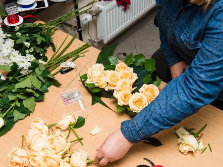 Woman working in flower shopの写真素材
