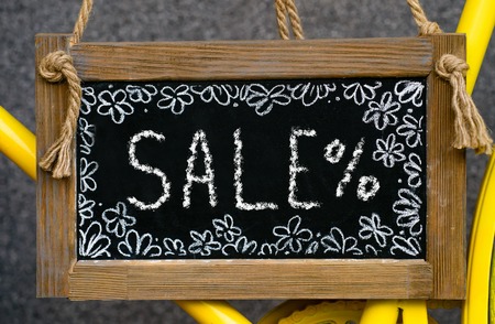wooden board with word sale written with chalk, signboard. symboの写真素材