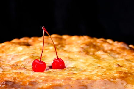 selective focus on cherry on delicious hot cherry pie, dark backの写真素材