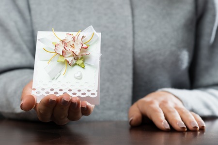 woman received beautiful postcard. Symbol of holiday, affection,の写真素材