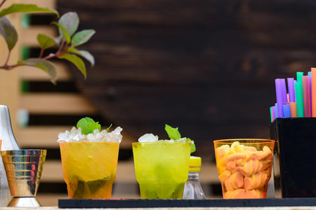 selective focus on cold fresh summer cocktails in glasses with s