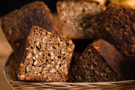 close-up traditional artisan rye bread loaves with walnut and se