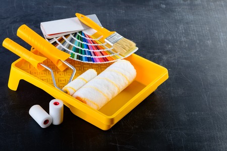 Color samples catalog, brush, paint tray and paint rollers, diffの写真素材