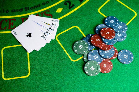 Concept of casino, playing cards and money. Stacks of poker chip