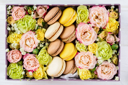 Box with flowers and macaroonsの写真素材