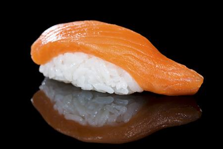Japanese cuisine. Appetizing salmon and rice on dark backgroundの写真素材