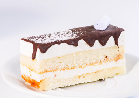 Slice of delicious sweet layered glaze cake