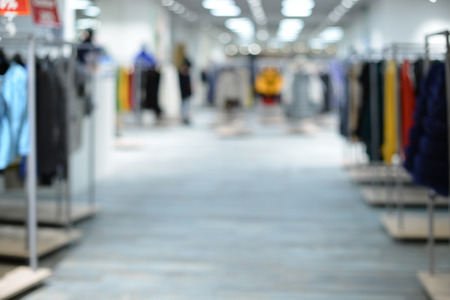 Blurred image of clothes in clothing department. Defocused superの写真素材