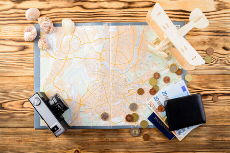 Accessories for travel. Retro vintage photo camera, travel map,の写真素材