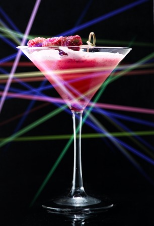 Cocktail in a nightclub with Laser ray, close-up on the barの写真素材