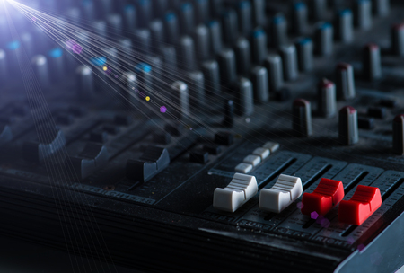 Recording mixer in the rays of light, DJ booth at a nightclubの写真素材