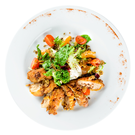 Delicious juicy roasted meat with spices and parsley in a white plate on light background. Top view, flat layの写真素材