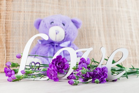 Valentine's day concept with toy bear, letters love and flowerの写真素材