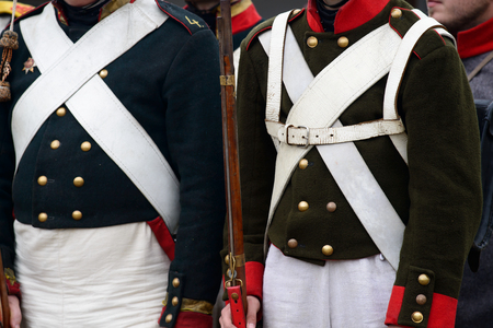 two men dressed in historical 1812 uniform close upの写真素材