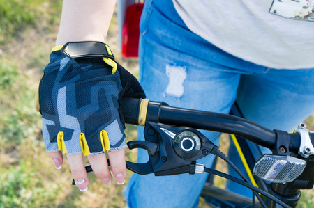 close-up rider s hand in gloves on a mountain bike handlebars. Extreme sport concept.の写真素材