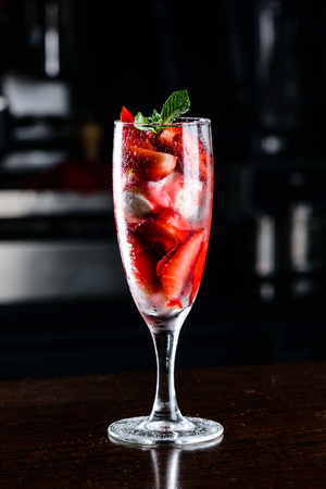 Dessert. Strawberries with ice-cream in the glass on the table, selective focusの写真素材