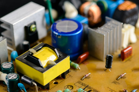 Close up macro on electronic system with integrated circuit chip and capacitors