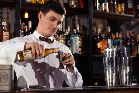 Cocktail bars, bartender making a cocktail February 6th Bartender's Day Minsk, toned, Belarus, 2019のeditorial素材