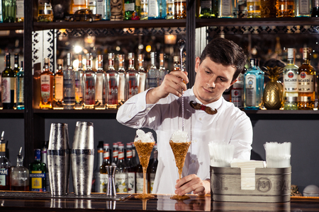 Cocktail bars, bartender making a cocktail February 6th Bartender's Day Minsk, toned, Belarus, 2019のeditorial素材