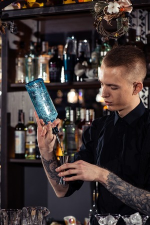 Cocktail bars, bartender making a cocktail February 6th Bartender's Day Minsk, toned, Belarus, 2019のeditorial素材