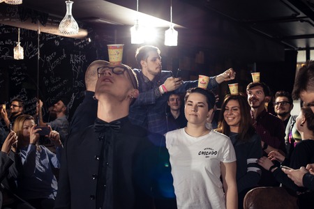 Cocktail bars, cheerful company of friends celebrates February 6th Bartender's Day Minsk, toned, Belarus, 2019のeditorial素材